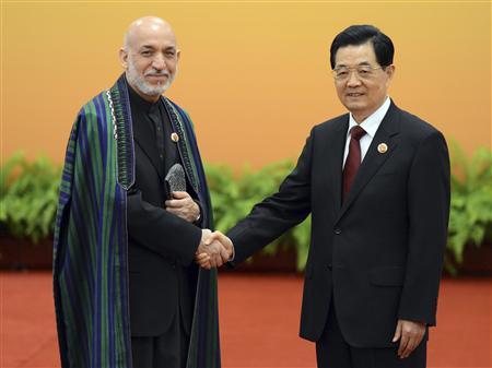 Karzai cuts short China trip after Afghan attacks