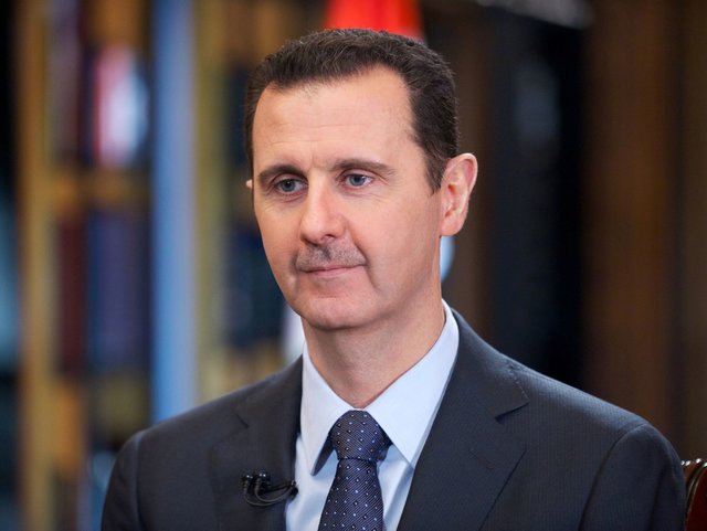 Assad regards Syrian war as int