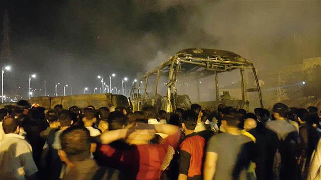 11 people die as fuel tanker collides with bus in Iran