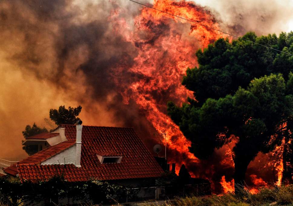 At least 70 killed in wildfire raging near Athens, people flee to beaches