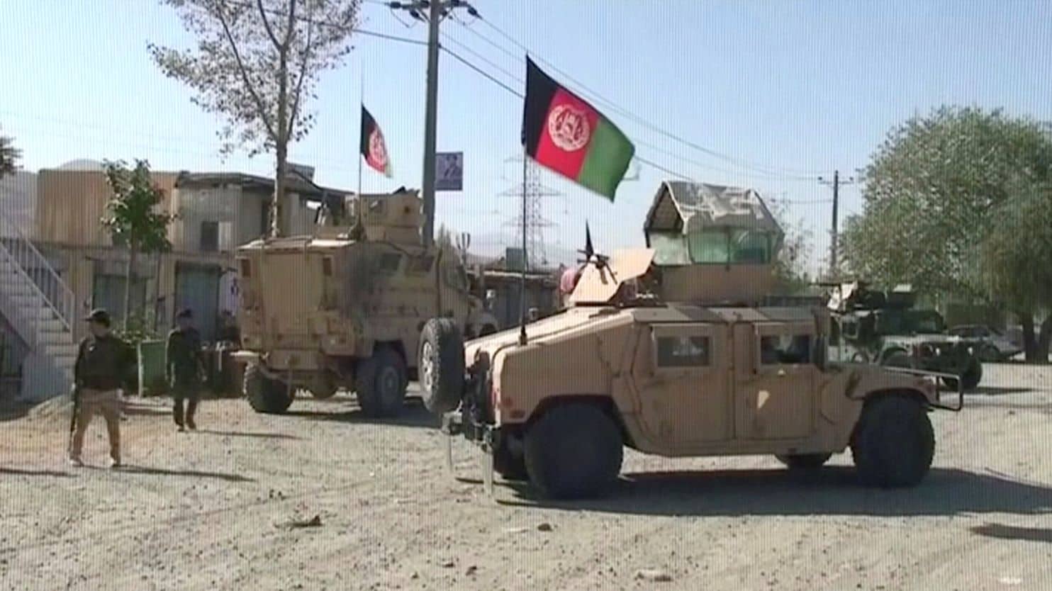 Afghan forces use artillery to repel multiple Taliban assaults that kill at least 21