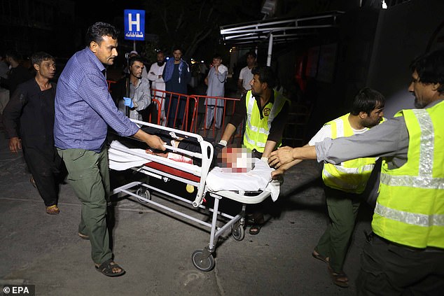 Bomb explodes at wedding in Kabul injuring at least 20 as wounded guests are stretchered out and rushed to hospital