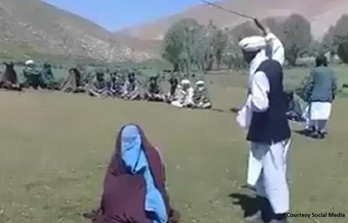 Taliban militants flog a young couple on charges of eloping