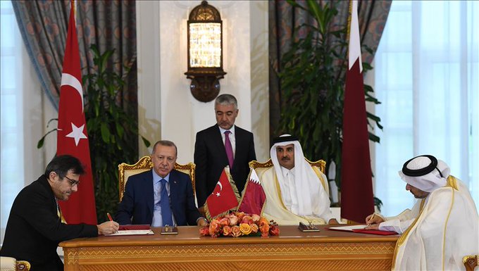 Signing takes place in presence of Turkish President Erdogan, Qatari Emir Al-Thani in Qatar