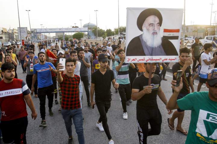 Iraqis rally to decry Saudi paper’s offensive cartoon of Ayatollah Sistani