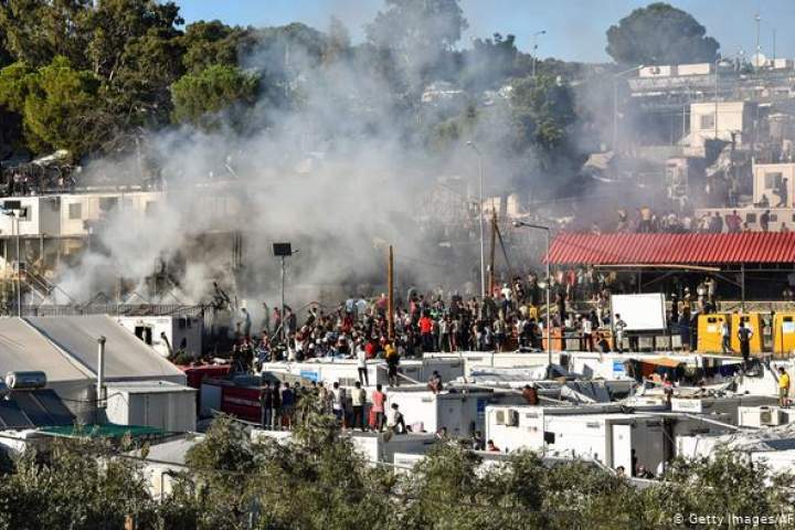 Greek Police Fire Teargas At Refugees Demanding To Leave Burned Down Camp