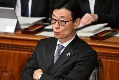 The financial scandal caused the resignation of three Japanese cabinet ministers